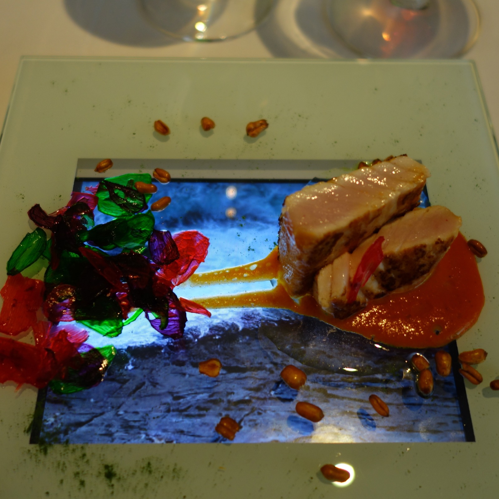 white tuna with garlic petals of different colors, served over a